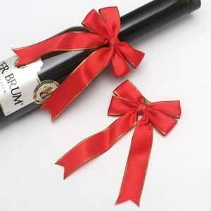 Elegant red velvet bow with gold edges for luxury gift wrapping and wine bottle decoration