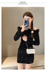 Mirror selfie showing a black sequin dress with feather trim and a small silver clutch