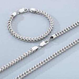 Detail view of silver stainless steel Franco chain necklace and bracelet with lobster clasp