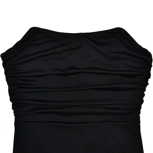 Close-up of the elegant black ruched fabric texture on a backless bodycon dress