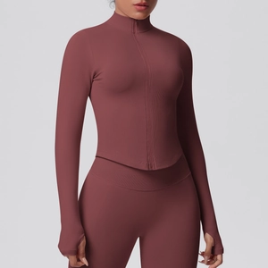 Detail view of high-waist fitness leggings and zip-up jacket with thumbhole cuffs