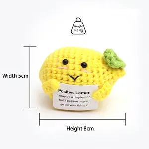 Detail view of handmade crochet lemon toy with inspirational card measuring 5cm in width