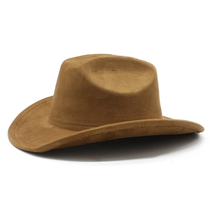 Detail of dark camel faux suede western cowboy hat with smooth texture and curved brim