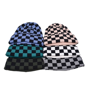 Checkboard knit beanies in multiple colors including black and white, soft winter hats