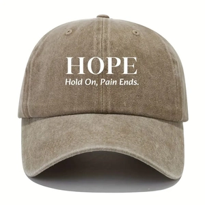 Close-up of HOPE print on washed cotton baseball cap with Hold On Pain Ends text