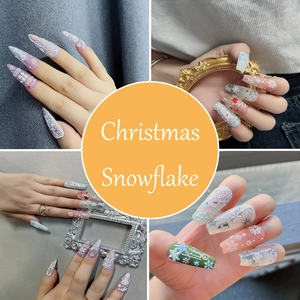 Detailed 5D embossed Christmas snowflake and reindeer patterns on long coffin nails