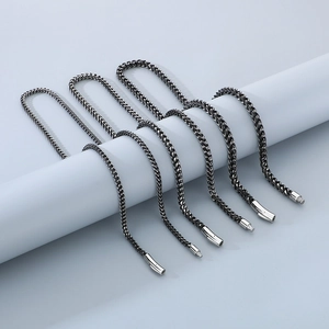 Detailed view of silver matte dragon bone chain necklaces with secure insert clasps
