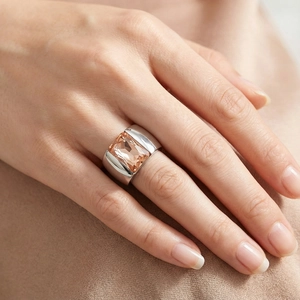 Macro view of wide silver steel ring featuring a large rectangular champagne crystal