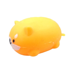 Macro view of a soft yellow TPR Shiba Inu squishy toy with a translucent stretchy texture