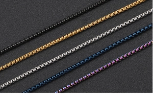 Close-up of square pearl chains in black, gold, silver, blue and rainbow stainless steel