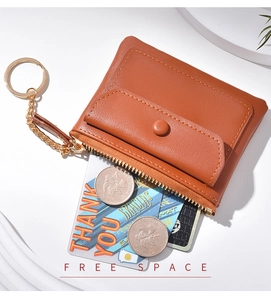 Brown leather mini coin purse with zipper, front snap pocket and gold keychain detail