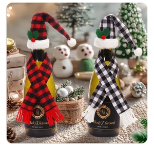 Detail view of plaid mini Christmas hats and scarves set for wine bottle decoration