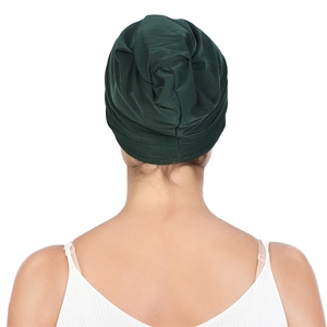 Detailed back view of dark green pleated headscarf cap with soft fabric texture