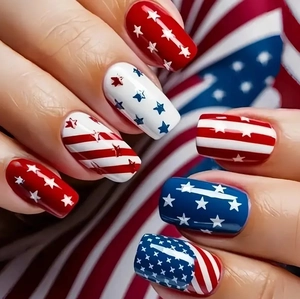Independence Day nail art with red white stripes and blue stars patterns on manicured nails