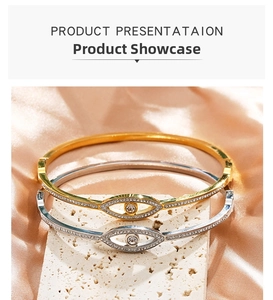 Close-up of gold and silver evil eye bangles with micro-pave crystals on stone