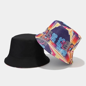 Detail of retro graffiti bucket hat with 80s 90s neon print and plain black cotton finish