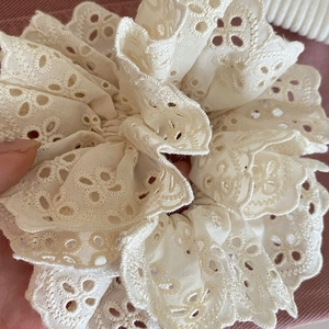 Chic oversized cream lace scrunchie with hollow embroidery and wavy edge details