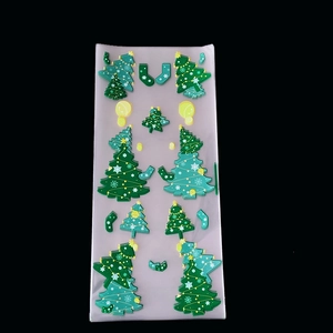 Macro detail of transparent Christmas tree and star plastic decorations for gift packaging