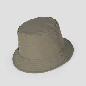 Detail of olive green nylon bucket hat with reinforced brim stitching and flat top