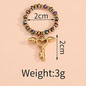 Detail view of colorful bead ring with gold heart key charm and wing accent dimensions
