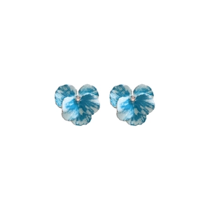 Elegant iris blue pansy flower stud earrings with sparkling crystal center on white background