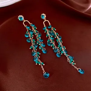 French palace style earrings with gold tassels, blue crystals and turquoise beads