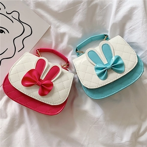 Cute kids crossbody handbags with 3D rabbit ears and bows in blue and rose pink