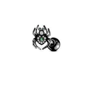 Piercing araignée en acier noir avec cristaux verts sur fond blanc épuré