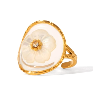 Detailed view of a gold shell flower open ring with hammer texture and resin petals