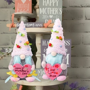 Detail of Mother's Day gnomes set featuring pink heart signs and floral felt hats
