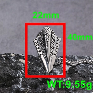 Macro view of Viking spearhead pendant with rune engravings and size dimensions