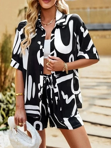 Detail of loose-fit summer set with black and white graffiti print and drawstring waist