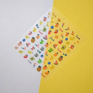 Detail of 3D embossed fruit nail stickers with strawberry and watermelon designs