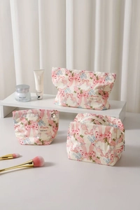 Detailed set of cotton cosmetic bags with pink bow print and metal zipper