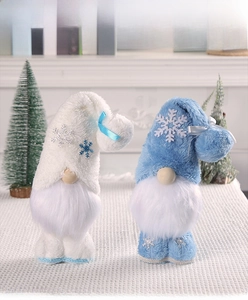 Detail of plush Christmas gnomes with snowflake hats and fluffy white beards