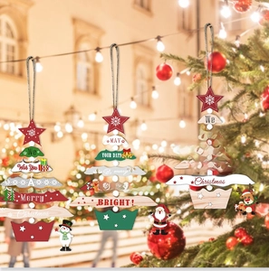 Detailed view of wooden Christmas tree ornaments with colorful hanging beads and strings