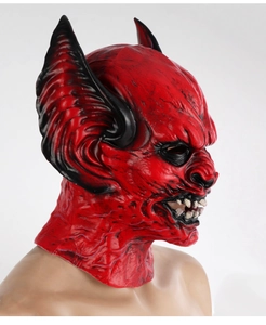 Macro detail of scary red devil bat mask with large horns and sharp fangs for Halloween