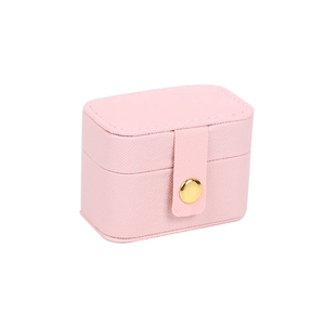 Pink textured leather travel jewelry box with gold snap button for rings and earrings