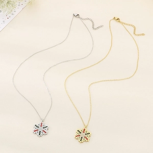 Macro detail of snowflake pendants with sparkling colorful rhinestones in gold and silver