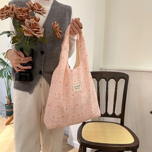 Detail of pink bubble fabric tote bag with 3D embossed bear pattern and soft texture