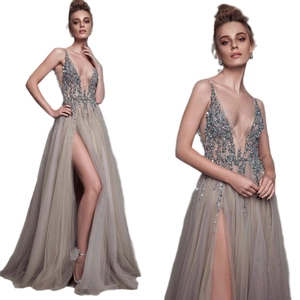 Elegant champagne V-neck evening gown with sequins and high-slit tulle skirt