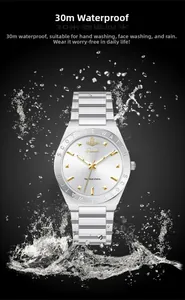 Detail of white round dial with gold markers and silver strap showing 30M water resistance