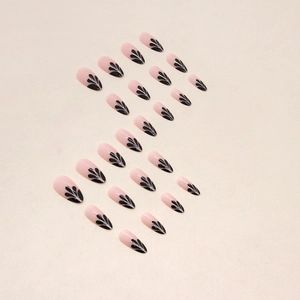 French almond press-on nails with black petal patterns and nude pink base, 24 pieces set