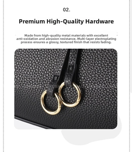 Detail of high-quality gold metal buckles on a black pebble leather crossbody bag strap