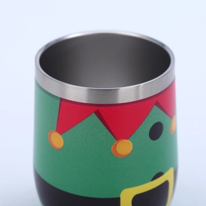 Close-up of 12oz stainless steel egg cup with festive green Christmas elf print