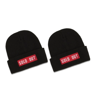 Classic black knitted beanie featuring a red SOLD OUT embroidery patch on the folded cuff