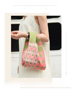 Detailed knit texture of pink and green geometric pattern on a casual tote bag