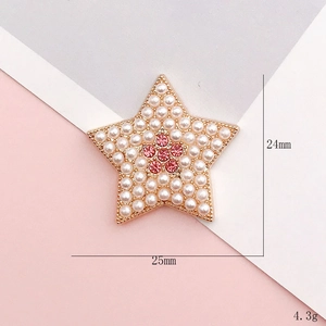 Star-shaped shoe charm with white pearls and pink rhinestones in gold setting