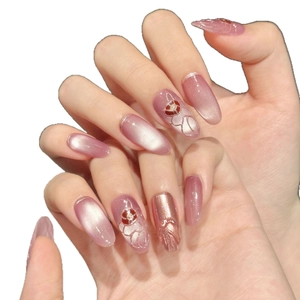 Pink gradient cat-eye press-on nails with 3D embossed flowers and metallic rose gold accents