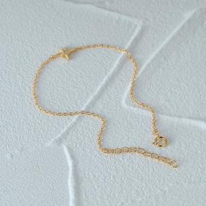 Detailed shot of S925 sterling silver gold octagonal star bracelet with extension chain